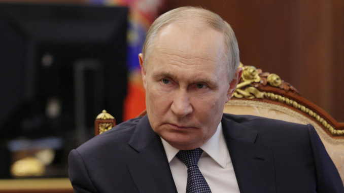 путін